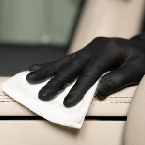 Detailing1 COLOURLOCK New Leather Care Set — spreading Leather Shield over the light leather with the cloth